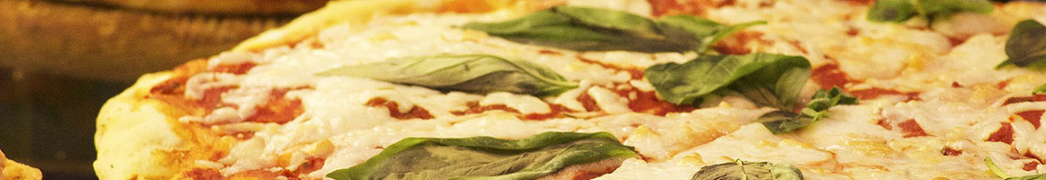 Eating Italian Pizza at Dino's Italian Bistro restaurant in Shavertown, PA.